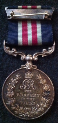 AN ORIGINAL "UNNAMED" MILITARY MEDAL (GV) On original pin and ribbon.As Issued to Foreign Troops (Interestingly, This example which had clearly been looted was taken from a dead German soldier during WW2 in Belgium) 