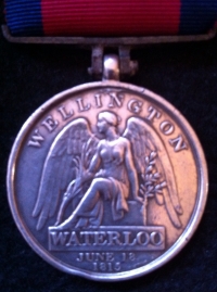 A HIGHLY DESIRABLE & HISTORICALLY IMPORTANT WATERLOO MEDAL. To:152 FRANCIS CURRIE, 2nd Bn COLDSTREAM GUARDS. "Wounded at HOUGOUMONT FARM" during the famous 