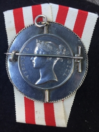 A UNIQUE & GREATLY ATTRACTIVE "INDIAN MUTINY" BROOCH. MADE FROM A TWO CLASP (LUCKNOW & RELIEF of LUCKNOW) "INDIAN MUTINY" MEDAL. To: JOHN WESTLEY. 1st Bn 23rd ROYAL WELSH FUS.