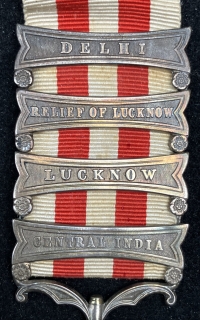 A Superb & Extremely Rare “FOUR CLASP” INDIAN MUTINY MEDAL, 1857—(DELHI)-(RELIEF OF LUCKNOW)-(LUCKNOW)-(CENTRAL INDIA) To:  Syce Driver, Uttree Pershad , 3rd Coy, 1st Bn Bengal Artillery.